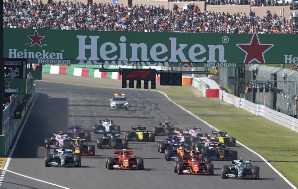 FILE - In this Oct. 13 2019, file photo, Mercedes driver Valtteri Bottas, right, of Finland passes Ferrari driver Sebastian Vettel of Germany at the start of the Japanese Formula One Grand Prix at Suzuka Circuit in Suzuka, central Japan. The 2021 Japanese Grand Prix has been canceled following discussions between the government and race promoters, Formula One organizers said Wednesday, Aug. 18, 2021.(AP Photo/Toru Hanai, File)