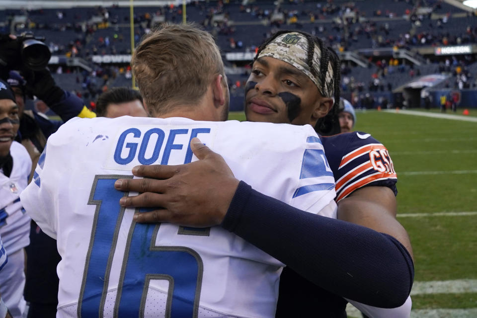 Detroit Lions quarterback Jared Goff (16) talks with Chicago Bears quarterback Justin Fields after an NFL football game in Chicago, Sunday, Nov. 13, 2022. (AP Photo/Charles Rex Arbogast)