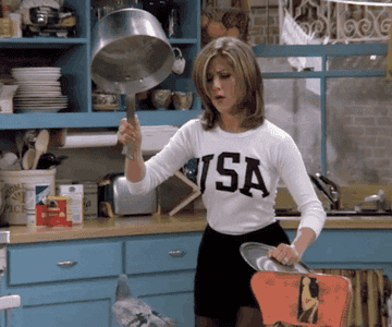 woman trapping a pigeon in the kitchen with a pot