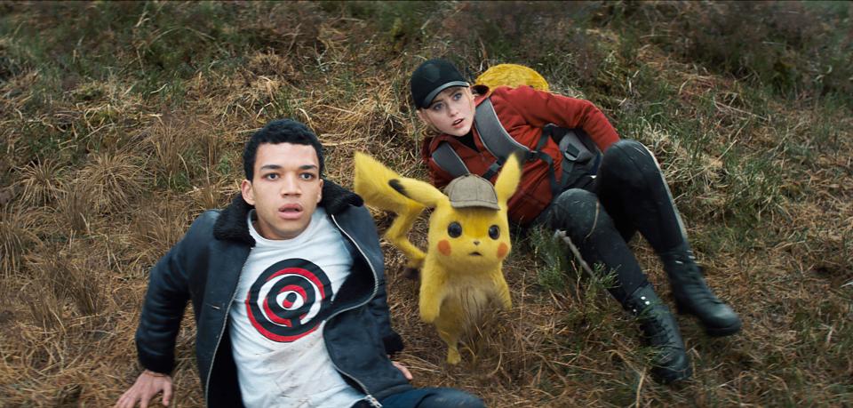 USA.  Justice Smith and Kathryn Newton in the ©Warner Bros new movie : Pokemon Detective Pikachu (2019).  Plot: In a world where people collect Pok mon to do battle, a boy comes across an intelligent talking Pikachu ( voiced by Ryan Reynolds ) who seeks to be a detective. Ref: LMK106-J4850-020519 Supplied by LMKMEDIA. Editorial Only. Landmark Media is not the copyright owner of these Film or TV stills but provides a service only for recognised Media outlets. pictures@lmkmedia.com