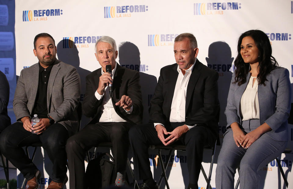 Progressive district attorney candidates George Gasc&oacute;n (second to left) and Rachel Rossi (far right) participate in a summit on reforming the Los Angeles County jail system. (Photo: Jesse Grant via Getty Images)