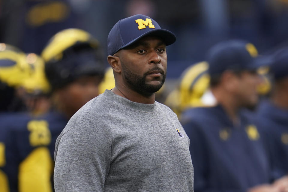 FILE - Michigan co-offensive coordinator Sherrone Moore looks on before an NCAA college football game against Maryland in Ann Arbor, Mich., Sept. 24, 2022. Moore and TCU's Garrett Riley will arrive at the Fiesta Bowl for a College Football Playoff semifinal Saturday, Dec. 31, 2022, as rising-star offensive coordinators. (AP Photo/Paul Sancya, File)