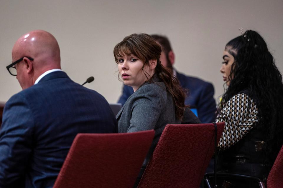 Hannah Gutierrez-Reed, center, sits with her attorney Jason Bowles, left, during the first day of testimony in the trial against her in First District Court, in Santa Fe, N.M., Thursday, February 22, 2024 (AP)