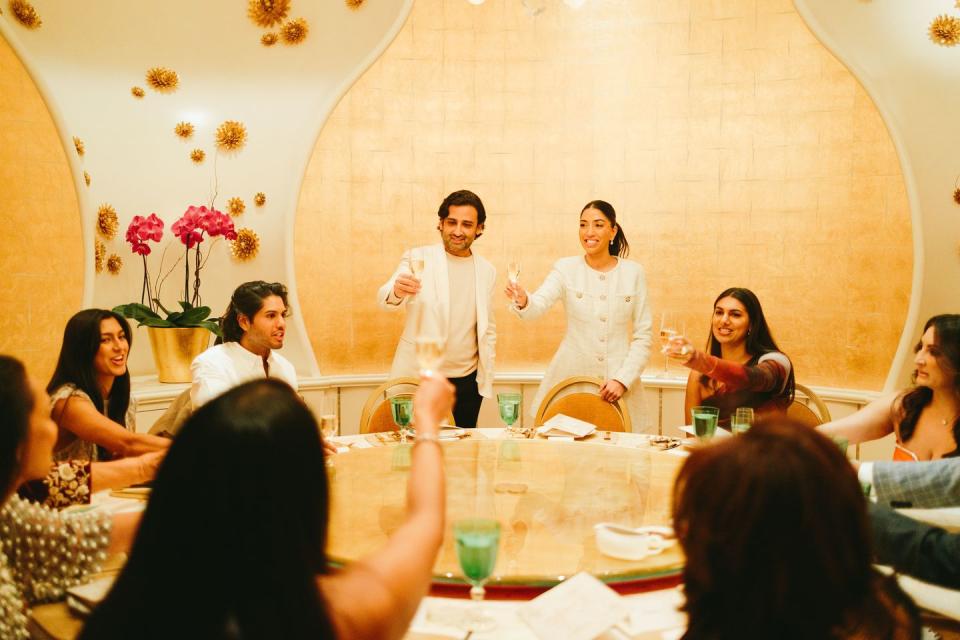 a group of people sitting around a table