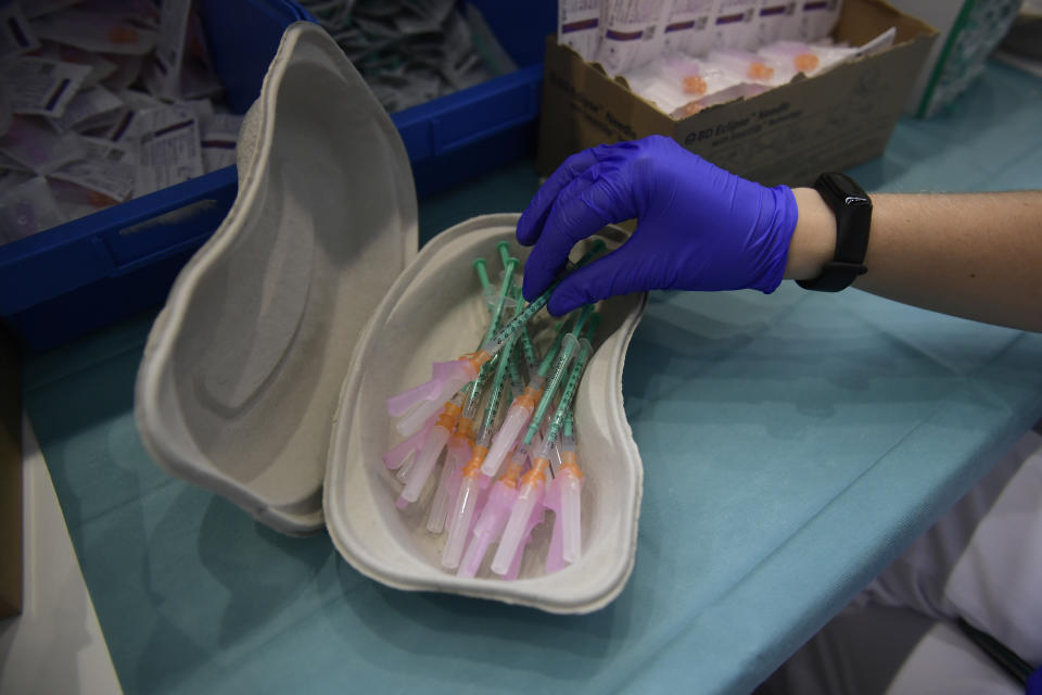 A health worker prepares Pfizer vaccines during the national COVID-19 vaccination campaign in Pamplona, northern Spain, Thursday, Sept. 2, 2021. Spanish authorities say more than seventy percent of citizens have been vaccinated. (AP Photo/Alvaro Barrientos)