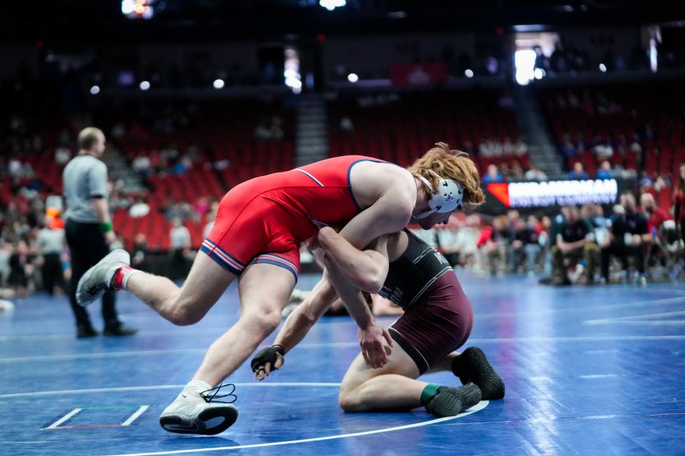 Mount Vernon's Caysen Curran and Ballard's Brody Sampson wrestle in the 2A-190 round Wednesday, Feb. 14, 2024, at Wells Fargo Arena.