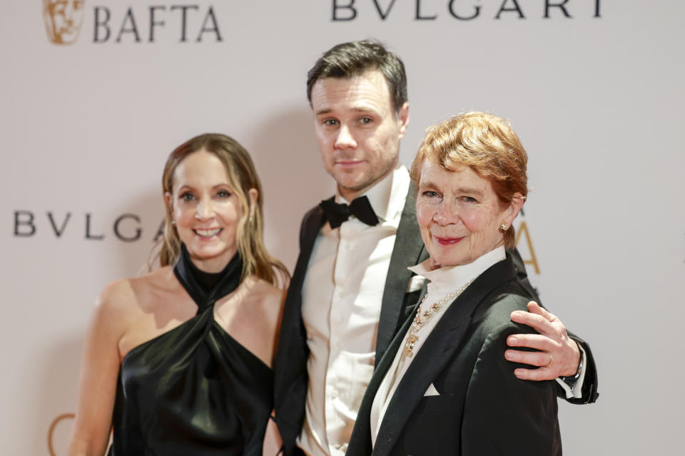 Joanne Froggat, from left, Rupert Evans, and Celia Imrie pose for photographers upon arrival at the BAFTA Gala event in London, Thursday, Feb. 15, 2024. (Photo by Millie Turner/Invision/AP)