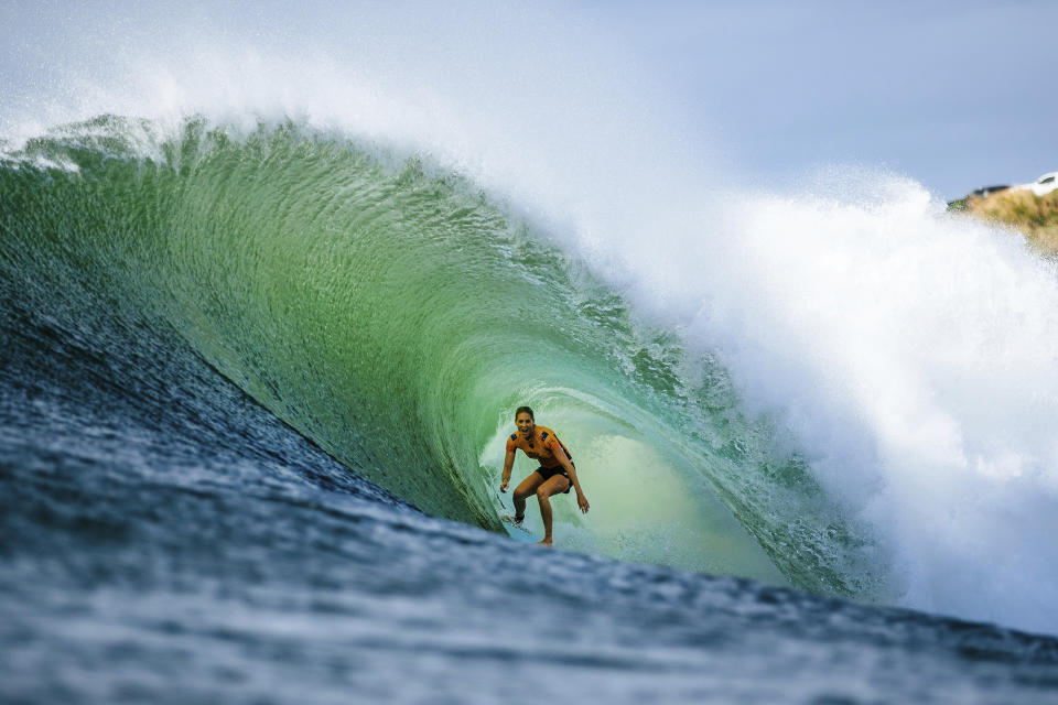 In this 2018 photo, Stephanie Gilmore of Australia competes at the Beachwaver Maui Pro, in Honolua, Hawaii. If Gilmore wins the gold medal when surfing makes its Olympic debut next year, it might be considered a very nice bonus. Now in the conversation as the greatest of all time on the women’s side in her sport, Gilmore successfully fought for another prize, equal pay for the women, on the professional tour where she and the rest of her rivals make their living. (Ed Sloane/World Surf League via AP)