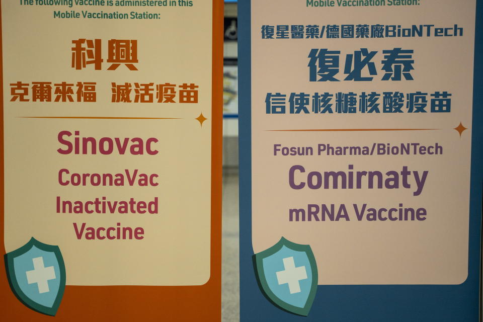 (Left) A sign for the Sinovac CoronaVac Inactivated Vaccine by China Biotechnology company, Sinovac Biotech Ltd., and (Right)a sign for the Comirnaty mRNA Vaccine by German biotechnology company BioNTech SE. inside an MTR Station on January 2, 2023 in Hong Kong, China. (Photo by Vernon Yuen/NurPhoto via Getty Images)