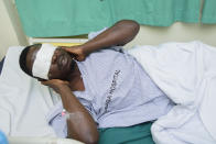 Mityana Municipality politician, Zaake Francis, close ally to opposition leader Bobi Wine gestures, in Rubaga hospital, Kampala, Uganda, Sunday, Jan. 17, 2021, after he was alledgedly beaten by security personnel at the gates of Bobi Wine's house on Saturday. A day after Uganda’s longtime leader was declared the winner of the country’s presidential election, the opposition party dismissed the results as “fraud” and called for the release of their leader, Bobi Wine, who has been under alleged house arrest for several days. (AP Photo/Nicholas Bamulanzeki)