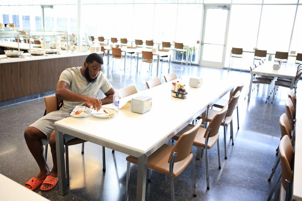 Jaguars linebacker Dequan Jackson eats lunch on Tuesday in the 5,000-square foot dining hall that is part of the team's Miller Electric Center.