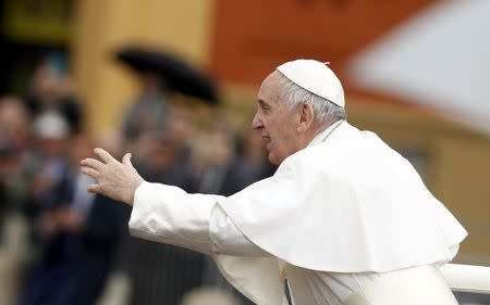 Pope Francis gestures as he leaves after a Holy Mass in Carpi, Italy, April 2, 2017. REUTERS/Alessandro Garofalo