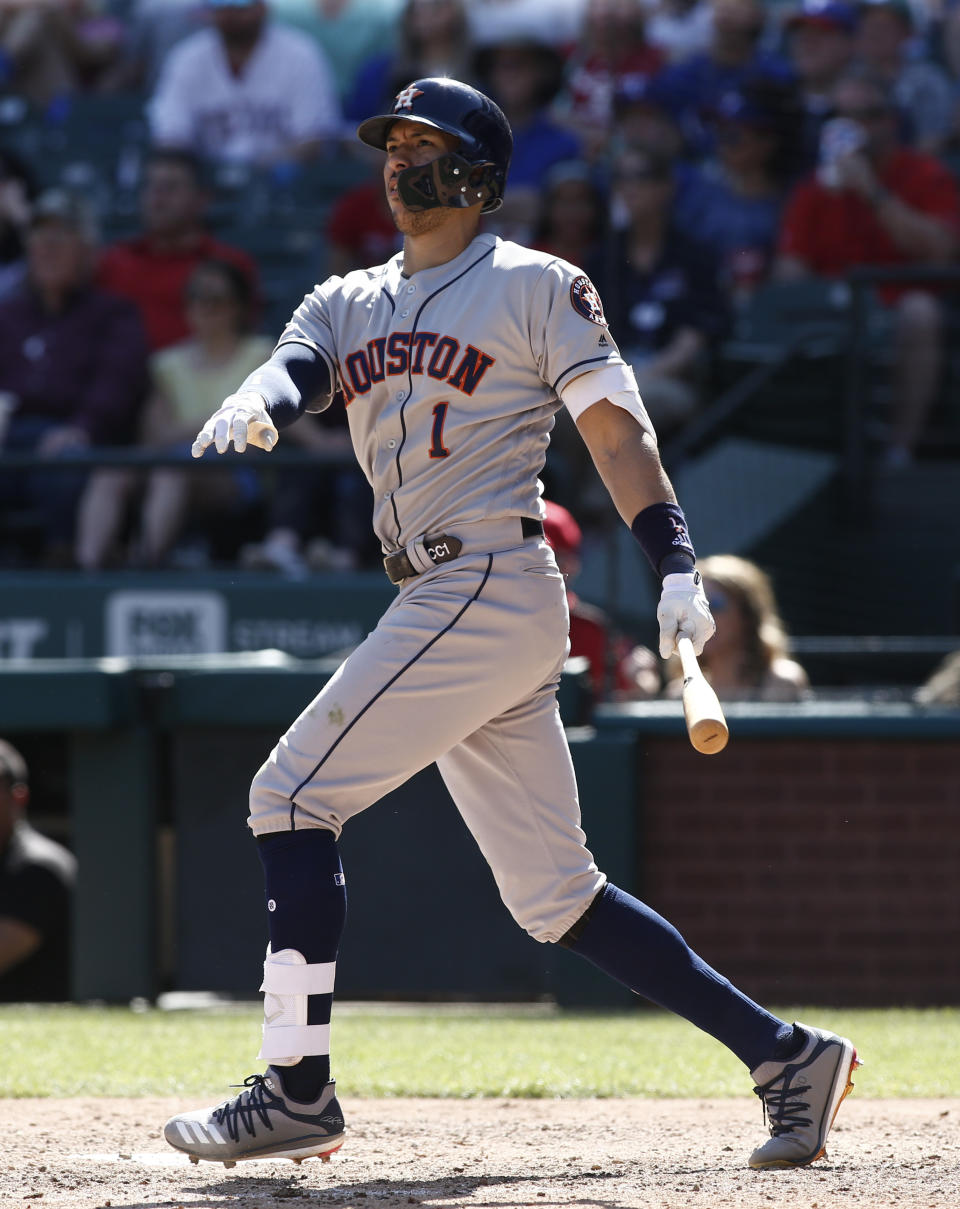 Houston Astros' Carlos Correa hits a home run against the Texas Rangers during the eighth inning of a baseball game Sunday, April 21, 2019, in Arlington, Texas. (AP Photo/Mike Stone)