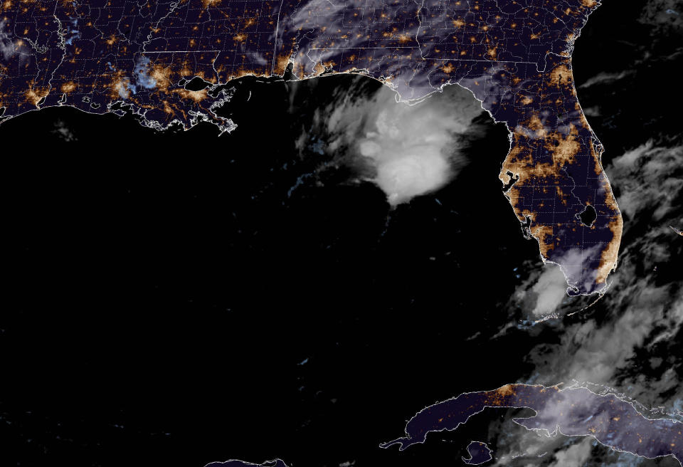 In a satellite image provided by NOAA, a tropical depression is seen in the Gulf of Mexico off the coast of Florida late Thursday, June 1, 2023, the first official day of the hurricane season. The storm had maximum sustained winds of 35 mph (55 kph) and was located about 290 miles (465 kilometers) west-northwest of Fort Myers, Florida, as of late Thursday, the National Hurricane Center said in an advisory. (NOAA via AP)