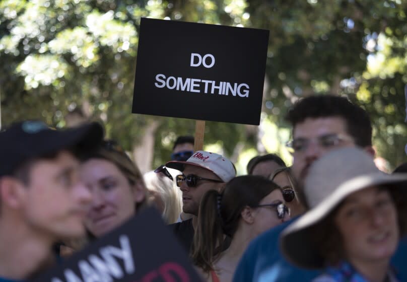 Los Angeles, CA - June 11: Participants listen to speakers during March for our Lives against gun violence downtown on Saturday, June 11, 2022 in Los Angeles, CA. (Brian van der Brug / Los Angeles Times)