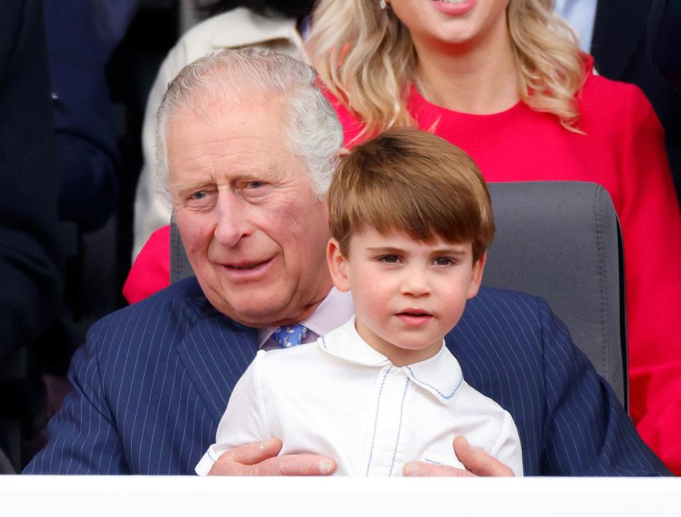 london, united kingdom june 05 embargoed for publication in uk newspapers until 24 hours after create date and time prince louis of cambridge sits on his grandfather prince charles, prince of waless lap as they attend the platinum pageant on the mall on june 5, 2022 in london, england the platinum jubilee of elizabeth ii is being celebrated from june 2 to june 5, 2022, in the uk and commonwealth to mark the 70th anniversary of the accession of queen elizabeth ii on 6 february 1952 photo by max mumbyindigogetty images