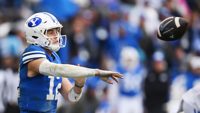 Brigham Young Cougars quarterback Jake Retzlaff (12) passes the ball as BYU and Oklahoma play at LaVell Edwards Stadium in Provo on Saturday, Nov. 18, 2023.