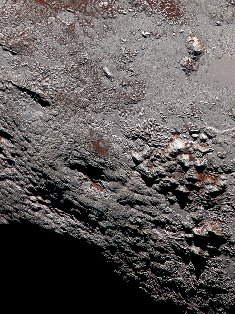 <span class="caption">Wright Mons, showing the distinctive summit depression.</span> <span class="attribution"><span class="source">NASA/JHUAPL/SwRI</span></span>