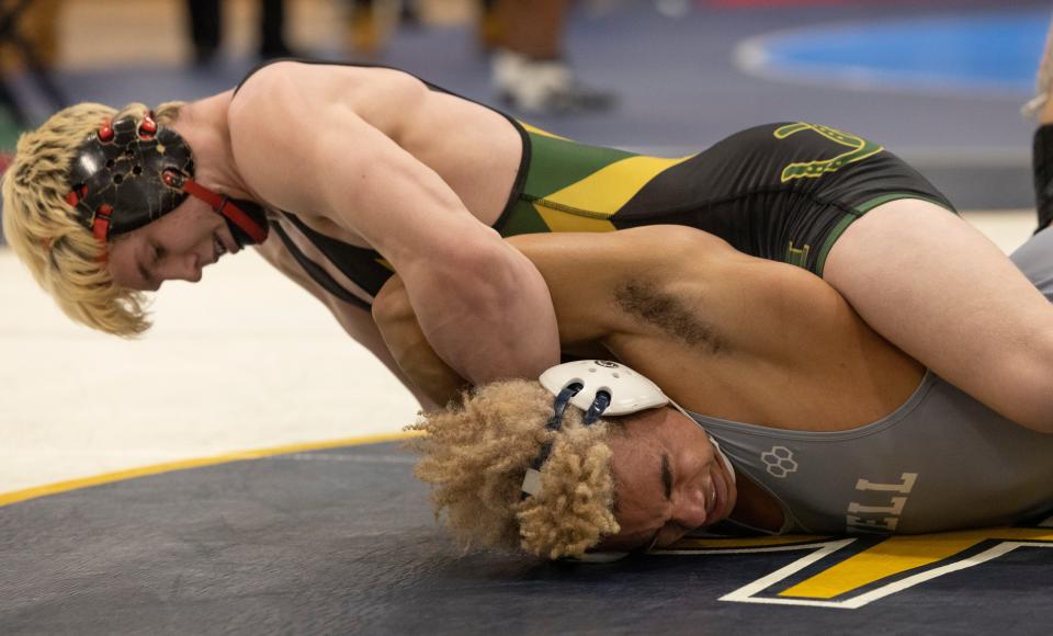 Brick Memorial freshman Harvey Ludington (top) pinned Howell's returning state qualifier D.J. Henry to win the Region 6 175-pound championship.