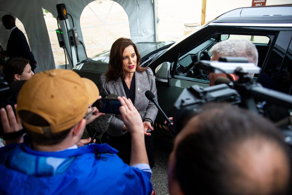 Gov. Gretchen Whitmer takes questions from the press during the launch of the new electric vehicle charging stations Thursday, May 26, 2022, at Holland State Park. New charging stations for State Parks comes in partnership with EV Manufacturer Rivian, Adopt-a-Charger and the State of Michigan. 