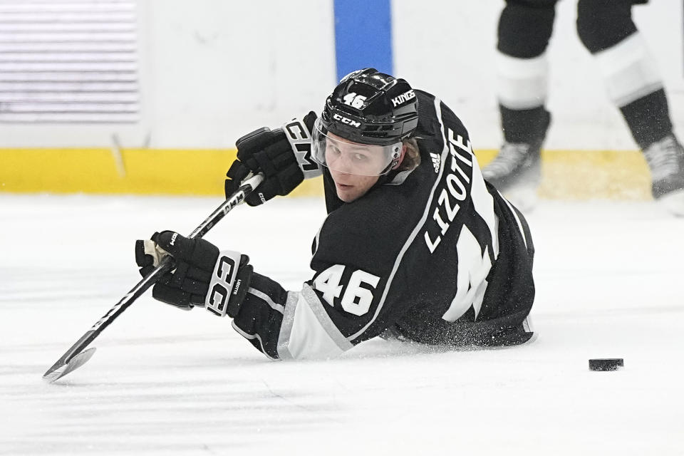 Los Angeles Kings center Blake Lizotte falls as he loses control of the puck during the first period of an NHL hockey game against the St. Louis Blues Saturday, March 4, 2023, in Los Angeles. (AP Photo/Mark J. Terrill)