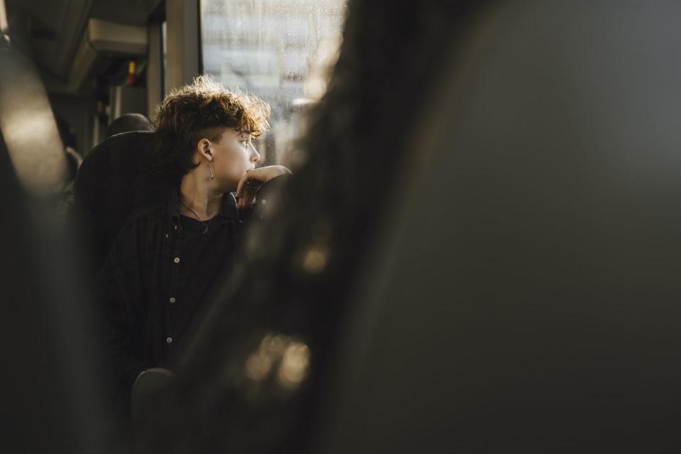 a person sitting in a train