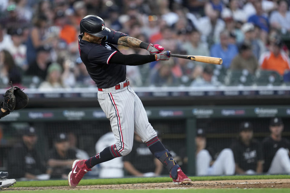 Minnesota Twins' Carlos Correa hits a home run against the Detroit Tigers in the sixth inning of a baseball game, Saturday, June 24, 2023, in Detroit. (AP Photo/Paul Sancya)