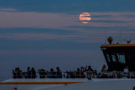 <p>In Istanbul, Turkey, stargazers took their moon-watching to the water. </p>