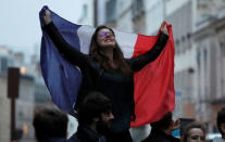 A supporter of President Elect Emmanuel Macron celebrates in Paris, France, May 7, 2017. REUTERS/Eric Gaillard