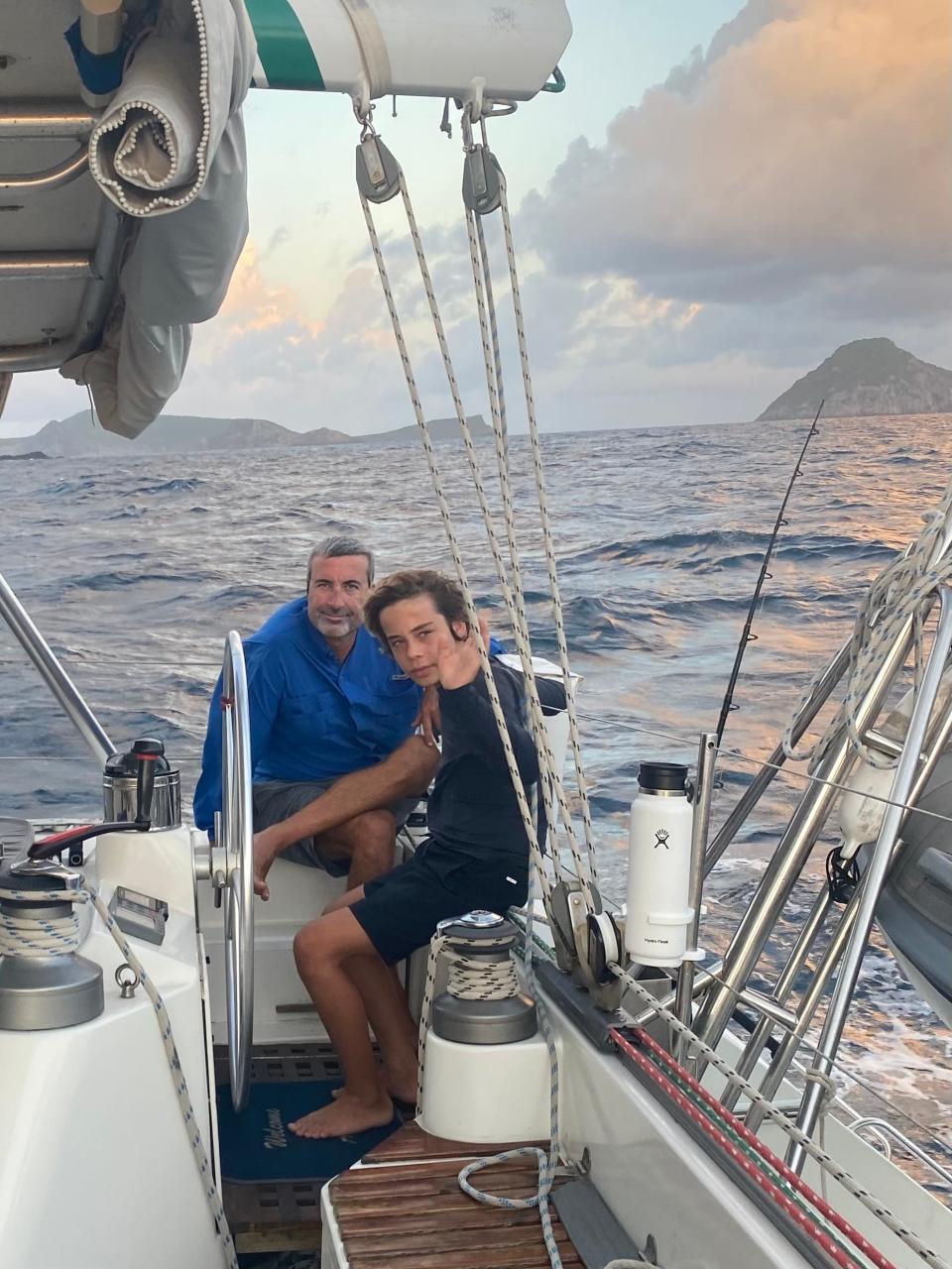 Kieran Medland has the wheel with Skipper Nate  Medland on deck somewhere in the Caribbean.