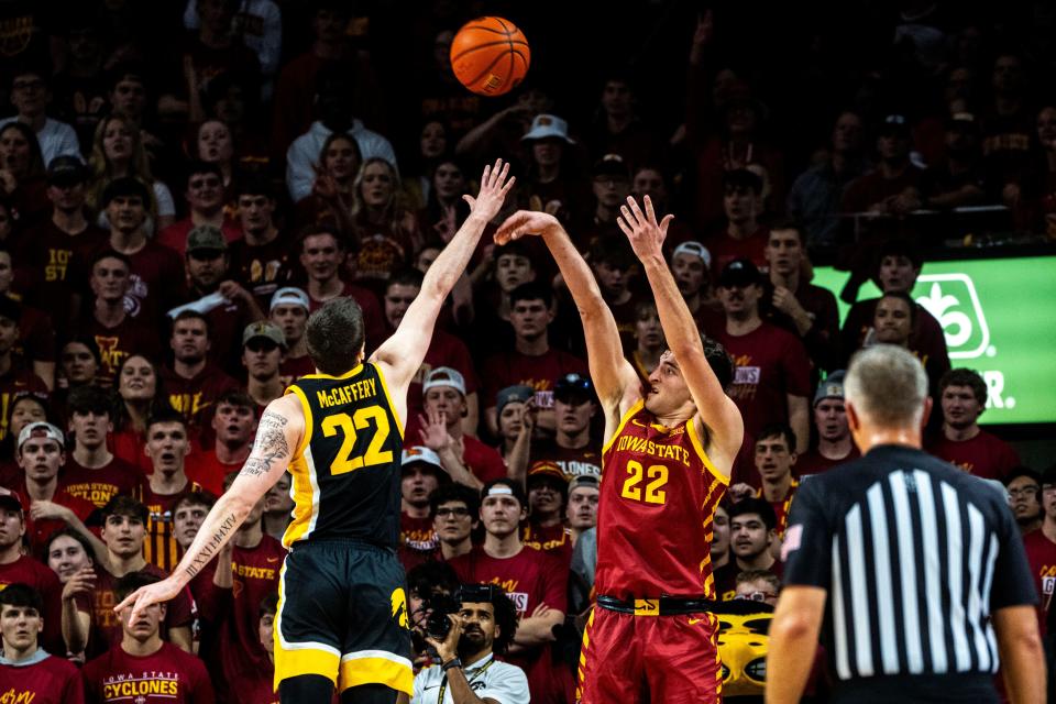 Iowa State's Milan Momcilovic attempts a shot against Iowa's Patrick McCaffery Thursday during the annual Cy-Hawk rivalry.