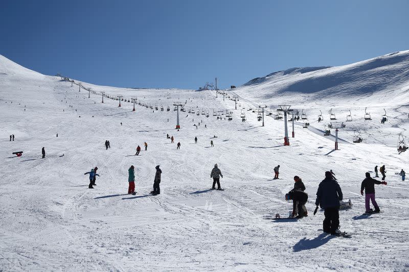 FILE PHOTO: Iranians ski at the Tochal ski resort, in north of Tehran