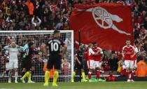 Britain Football Soccer - Arsenal v Manchester City - Premier League - Emirates Stadium - 2/4/17 Arsenal's Theo Walcott celebrates scoring their first goal with team mates Reuters / Eddie Keogh Livepic