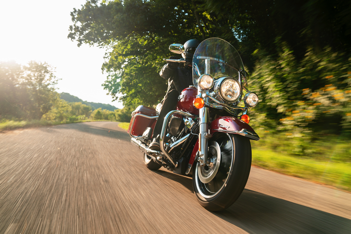 A motorcycle rider driving the Harley-Davidson Road King. This big, old-school bike is one of the models helping save the company.