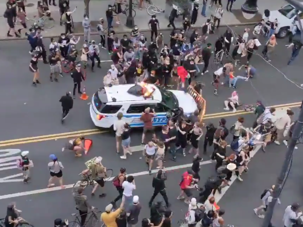 A NYPD rams into a crowd of protesters in Brooklyn on 30 May, 2020: Twitter/Pierre Garapon