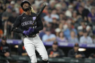 Colorado Rockies' Raimel Tapia reacts after striking out against San Francisco Giants starting pitcher Anthony DeSclafani in the third inning of a baseball game Saturday, Sept. 25, 2021, in Denver. (AP Photo/David Zalubowski)