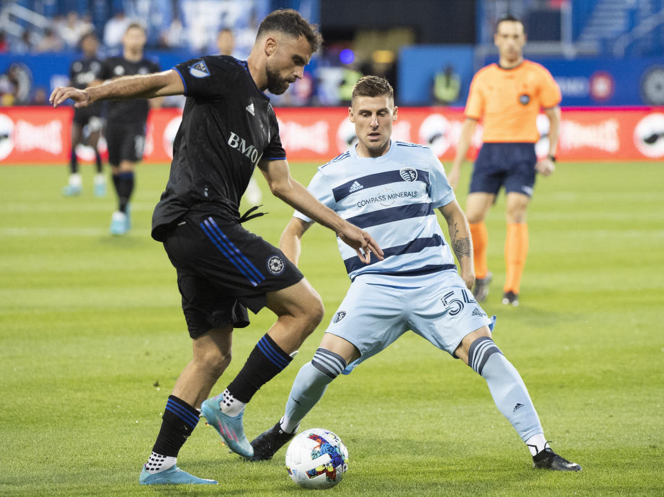 CF Montreal's Rudy Camacho, left, and Sporting KC's Remi Walter go for the ball during the second half of an MLS soccer match Saturday, July 9, 2022, in Montreal. (Graham Hughes/The Canadian Press via AP)