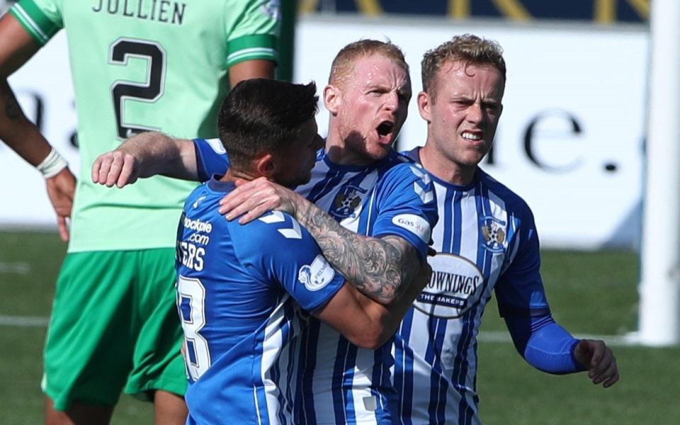 Chris Burke of Kilmarnock celebrates with his team-mates as they snatch a draw against Celtic - GETTY IMAGES