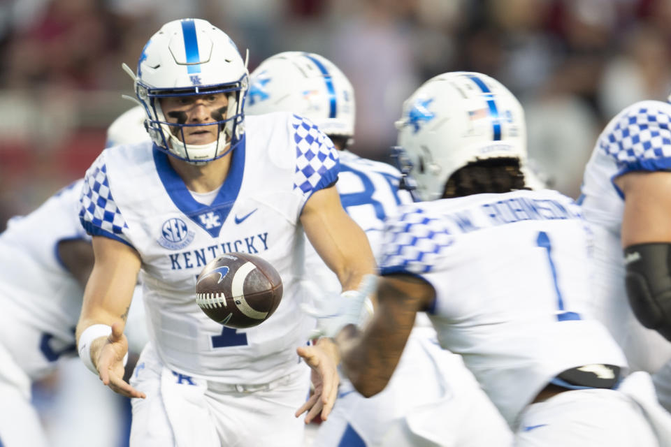 Kentucky quarterback Will Levis (7) pitches the ball to Kentucky wide receiver Wan'Dale Robinson (1) in the first half of an NCAA college football game against South Carolina, Saturday, Sept. 25, 2021, at Williams-Brice Stadium in Columbia, S.C. (AP Photo/Hakim Wright Sr.)