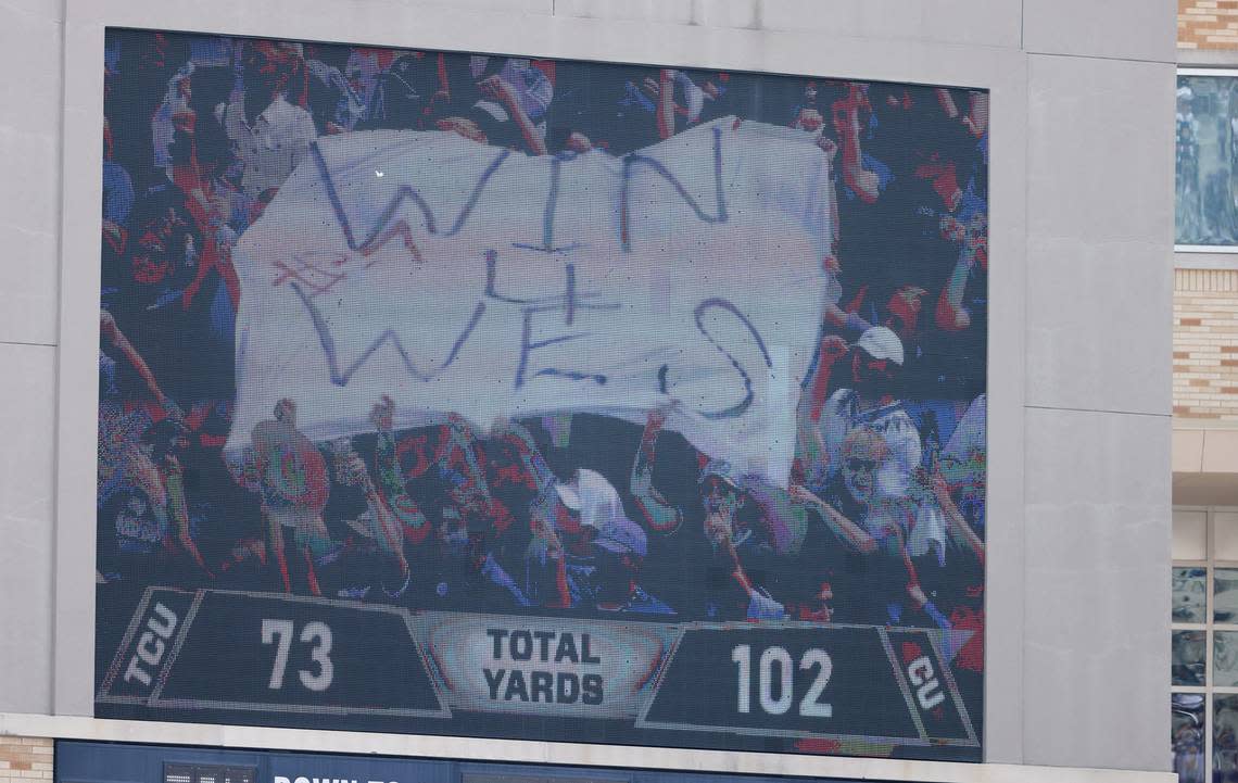 The Jumbotron at Amon G. Carter Stadium shows TCU fans flying a banner in memory of Wes Smith, a TCU student who was killed in a shooting on Friday, during the team’s season opener against Colorado on Saturday. 