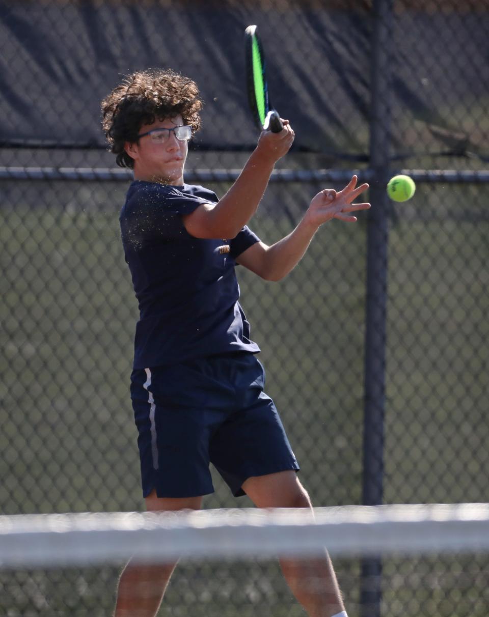 Pittsford Sutherland's Charlie Thyroff with a return during his fourth singles match against Fairport's Daniel van Aardt during their match Monday, May 17, 2021 at Pittsford Sutherland High School.