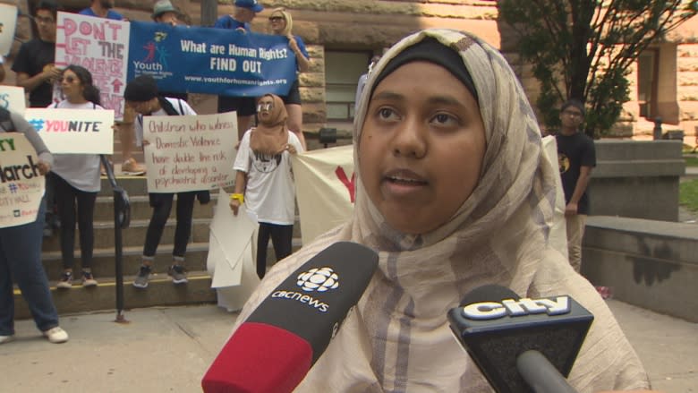 Youth march from Old City Hall to Regent Park to raise awareness about domestic abuse