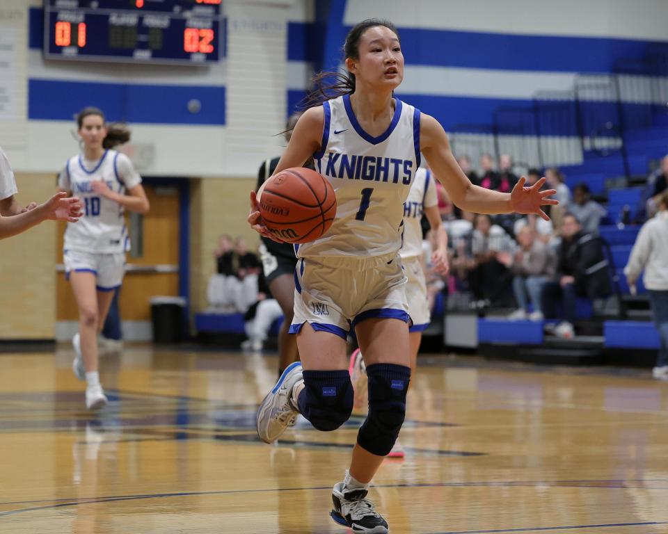 McCallum's Emy Chen (1) races for the layup against Navarro Jan. 19, 2024 as the host Knights rally back to win 47-42 at McCallum High School.