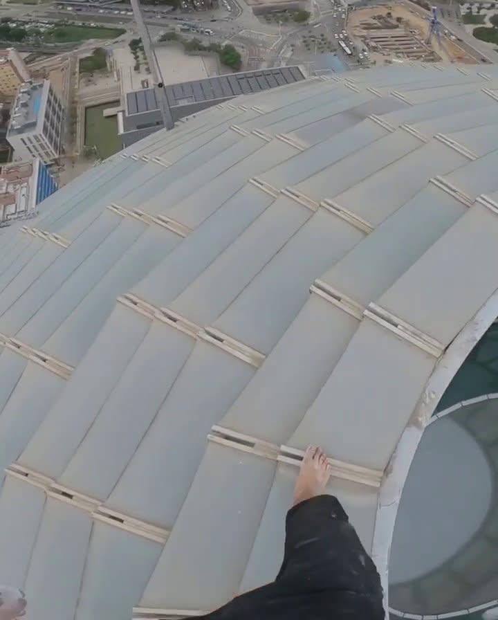 Adam Lockwood, 19, is no stranger to vertigo-inducing free climbing, having been successfully scaling buildings of up to 200 metres in the UK and Europe for the last two years, without any equipment. But his latest venture earlier this week saw Adam add a new challenge to his climbing. For the first time, Adam took on a skyscraper building - the 144-metre (472 feet) Torre Agbar tower in Barcelona, Spain - completely barefoot. The teen, from Manchester, had to keep stopping to rub chalk on his feet to help his grip, as he climbed the ladder-like structure on the outside of the office block.