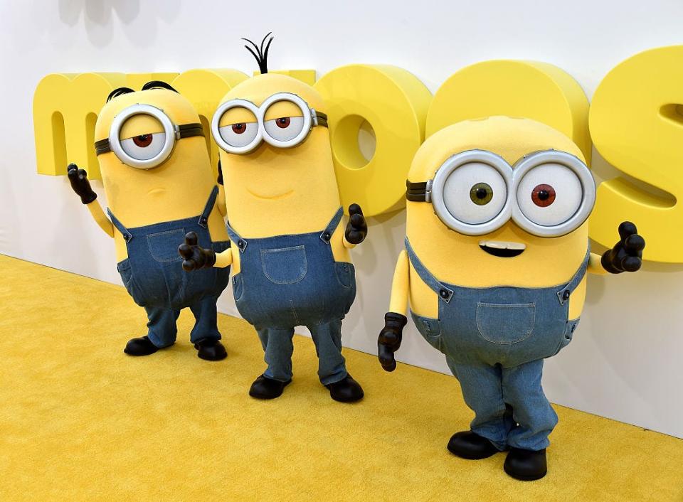 Minions wave at the premiere of Universal Pictures and Illumination Entertainment's "Minions" at the Shrine Auditorium on June 27, 2015 in Los Angeles.