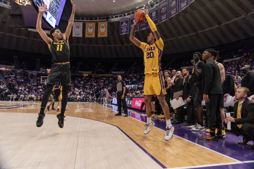 Mar 9, 2024; Baton Rouge, Louisiana, USA; LSU Tigers forward Derek Fountain (20) shoots a three point basket attempt against Missouri Tigers forward Trent Pierce (11) during the first half at Pete Maravich Assembly Center. Mandatory Credit: Stephen Lew-USA TODAY Sports