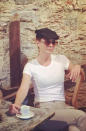 The actress looked every bit the Italian this week while lounging in a cafe in Sicily. We're digging the hat!