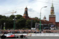 Formula One McLaren Mercedes' British driver Lewis Hamilton speeds near the Kremlin during the "Moscow City Racing" show on July 15, 2012 in central Moscow. AFP PHOTO / KIRILL KUDRYAVTSEVKIRILL KUDRYAVTSEV/AFP/GettyImages