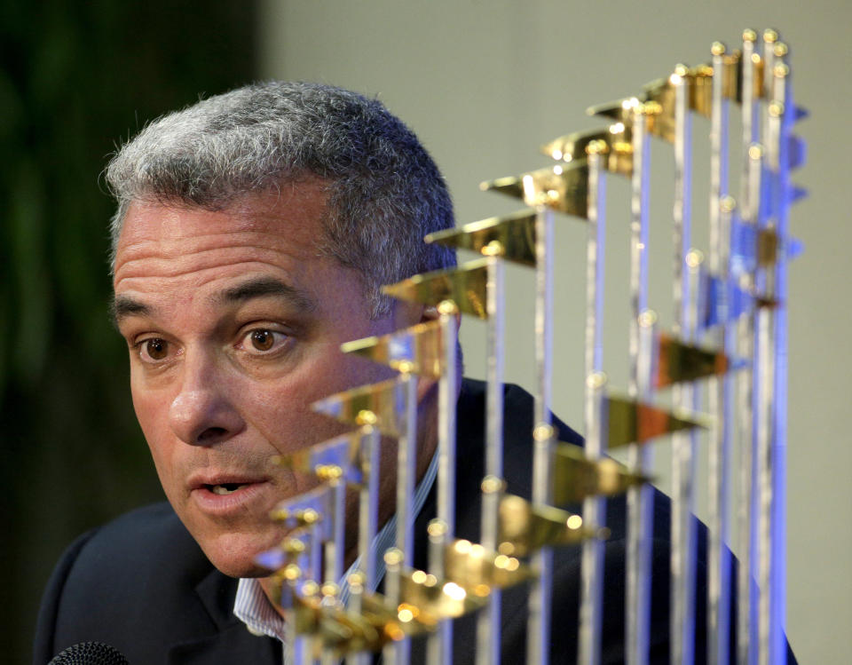 FILE - Kansas City Royals general manager Dayton Moore speaks to members of the media alongside the Royals' World Series trophy during a news conference wrapping up the team's season, in Kansas City, Mo., Nov. 5, 2015. The Kansas City Royals, Wednesday, Sept. 21, 2022, fired longtime general manager Dayton Moore. (AP Photo/Charlie Riedel, File)