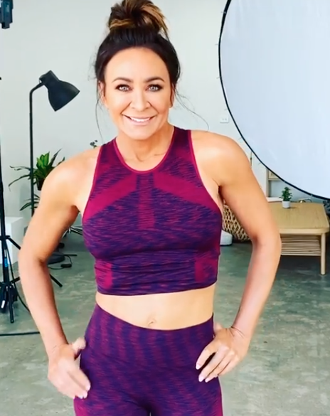 Michelle Bridges poses in active wear